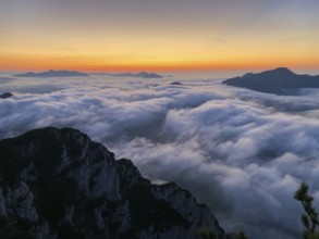 Sunset in the Chiemgau Alps with fog in the valley, view of Geigelstein, Kampenwand and Hochgern,