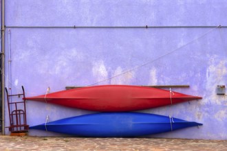 Two paddle boats attached to a wall, Burano, Veneto, Italy, Europe