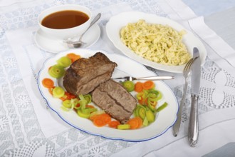 Swabian cuisine, roast beef, roast ox, herb spaetzle, meat dish, gravy, carrot vegetables, leek,