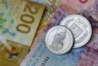 Swiss coins on banknotes, Switzerland, Europe