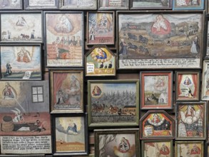 Votive pictures, votive tablets on the walls of the chapel of grace inside the church, pilgrimage
