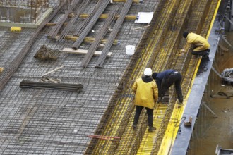 Construction site, reinforced concrete reinforcement bars, for a building ceiling, are installed