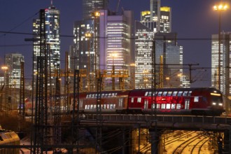 Railway tracks in front of the main railway station in Frankfurt am Main, skyline of skyscrapers in