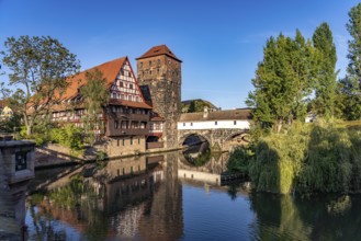 Half-timbered house Weinstadel and water tower on the Pegnitz in Nuremberg, Bavaria, Germany,