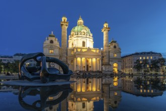 Sculpture by Henry Moore Hill Arches and the Karlskirche in Vienna at dusk, Austria, Europe