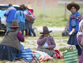 Peruvian woman in traditional traditional costume at the indigenous market in Chinchero, Cusco
