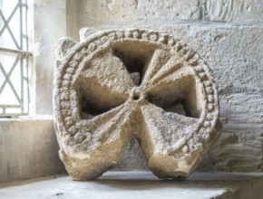 Head of ancient stone cross discovered in churchyard, church of Saint Michael, Yanworth,