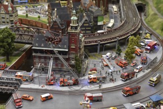 Fire brigade extinguishes burning house at Miniatur Wunderland Hamburg, Germany, Europe