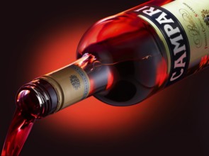 Campari is poured from the bottle