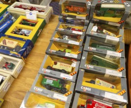 Boxes of Corgi model trucks, vans and other vehicles on display at auction, UK