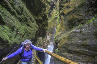 Woman on the climbing facility in the Raggaschlucht, Flattach, Carinthia, Austria, Europe