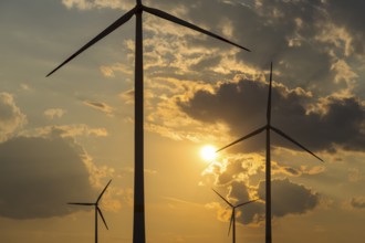 Wind farm, wind turbine, wind turbines, in front of sunset, storm clouds, Swabian Alb,