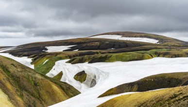 Colourful volcanic landscape with hills and snow, Laugavegur trekking trail, Landmannalaugar,
