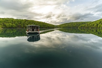 Electric tourist boat on the largest lake Kozjak in Plitvice Lakes National Park, Croatia, Europe