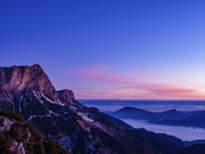 Dawn on the Untersberg, Berchtesgaden Alps, flatland in the fog behind, Bischofswiesen,