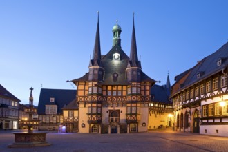 Market square with atmospherically illuminated town hall in the evening, Wernigerode, Harz,