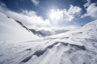 Snow-covered mountain landscape on the Wildhorn with sun star, High tour, Bernese Alps, Bernese