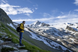 Mountaineer in front of high alpine mountain landscape, summit of the Aiguille de Chardonnet and