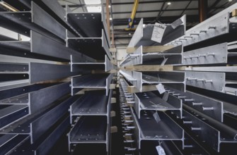 Finished galvanised steel parts lie in the factory hall of the surface finishing company Coatinc