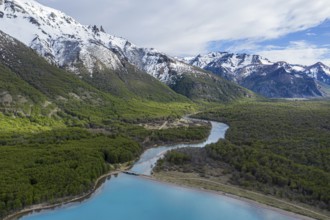 Aerial view of lake Lago Jeinimeni, river flowing out of the lake, glacial blue water in contrast