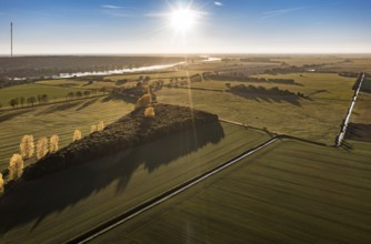 Aerial view of farmland and river Elbe near Lenzen, view to Höhbeck radio mast, sunset, Germany,