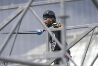 Scaffolders at work, erecting a large scaffold, grandstands for the Olympic Games, Place de la