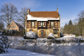 The snow-covered moated castle Haus Bisping in winter, Drensteinfurt, Münsterland, North