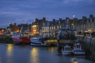 Barfleur, Normandy, France - Fishing boats on the quay in the harbour of Barfleur, a picturesque