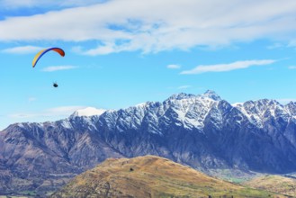Paragliding over the Remarkables mountain range, Queenstown, South Island, New Zealand, Oceania