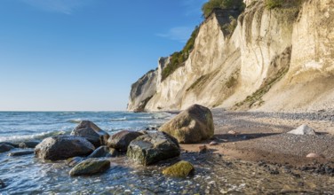 Beach with boulders at the chalk cliffs of Møns Klint on the Baltic Sea, Møn Island, Denmark,