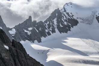 Mountain landscape with rock and snow, pointed narrow rocky ridge of the Großer Mösler summit with