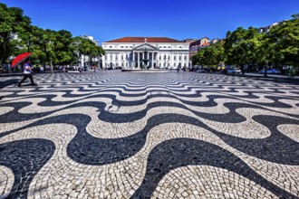 Wavy black and white patterned pavement in a sunny urban square with people and classic building in