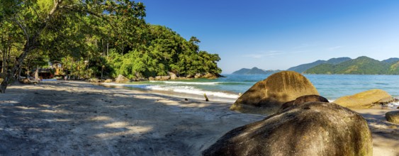 Castelhanos beach surrounded by forest and mountains on the island of Ilhabela in Sao Paulo,