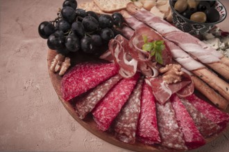 Appetizer, assortment, set, sausage, and cheese, on a wooden board, top view, no people