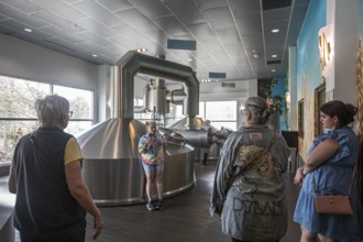 Covington, Louisiana - The Abita Brewing Company's craft beer brewery. A tour guide explains the