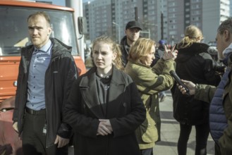 Bodyguards and Beatrix von Storch (in the background) at the final rally of Beatrix von Storch and