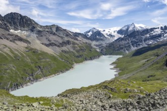 Picturesque mountain landscape, view of a blue mountain lake, Lac des Dix reservoir, behind