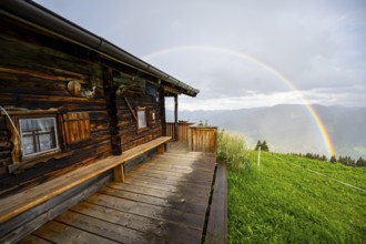 Mountain hut in the rain with rainbow, Hochbrixen, Brixen im Thale, Kitzbühel Alps, Tyrol, Austria,