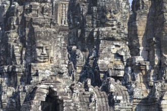 Panoramic image of giant stone-carved faces of the Bodhisattva Lokeshvara, also known as