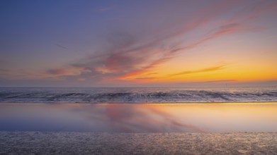 View of a tidal flat in the Wadden Sea at low tide at sunset, National Park, Unesco, World Natural