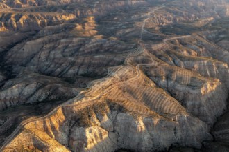 Sunrise, wide hilly desert landscape with dry vegetation, Gorafe desert, semi-desert, Granada,