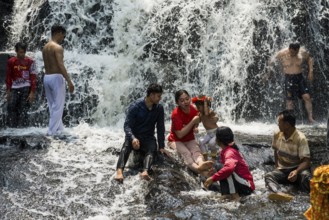 Kulen waterfall with bathing people, Phnom Kulen National Park, Siem Reap, Cambodia, Asia