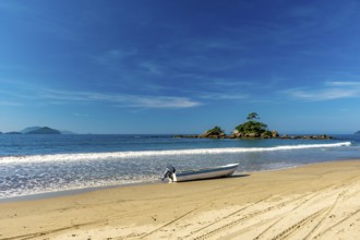 Speedboat on the sand of remote Castelhanos beach on the island of Ilhabela, Castelhanos beach,