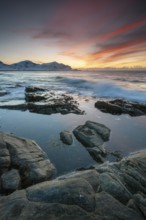 Sunset in winter at Skagsanden, rock formations on the beach at Flakstad, Flakstadøy, Lofoten,