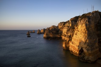 Colourful cliffs and rocks at sunrise on the beach, Praia da Dona Ana, Lagos, cliffs, Atlantic