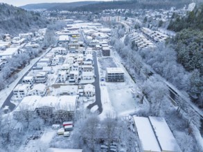 Aerial view of a snow-covered town with houses and streets in the foreground, Nagold, Black Forest,
