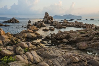 Lonely beach with granite rocks, sunrise, Spiaggia Poltu Manzu, Capo Ceraso, near Olbia, Sardinia,
