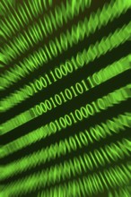 Swirling green binary numbers with blurring, techno-like representation