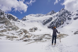 Woman hikes across a snowfield, Glaciar Vinciguerra, Ushuaia, Tierra del Fuego Province, Argentina,