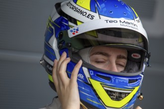 10 May 2024, Hockenheimring Germany : Spanish racing driver Alba Vazquez puts on her helmet and
